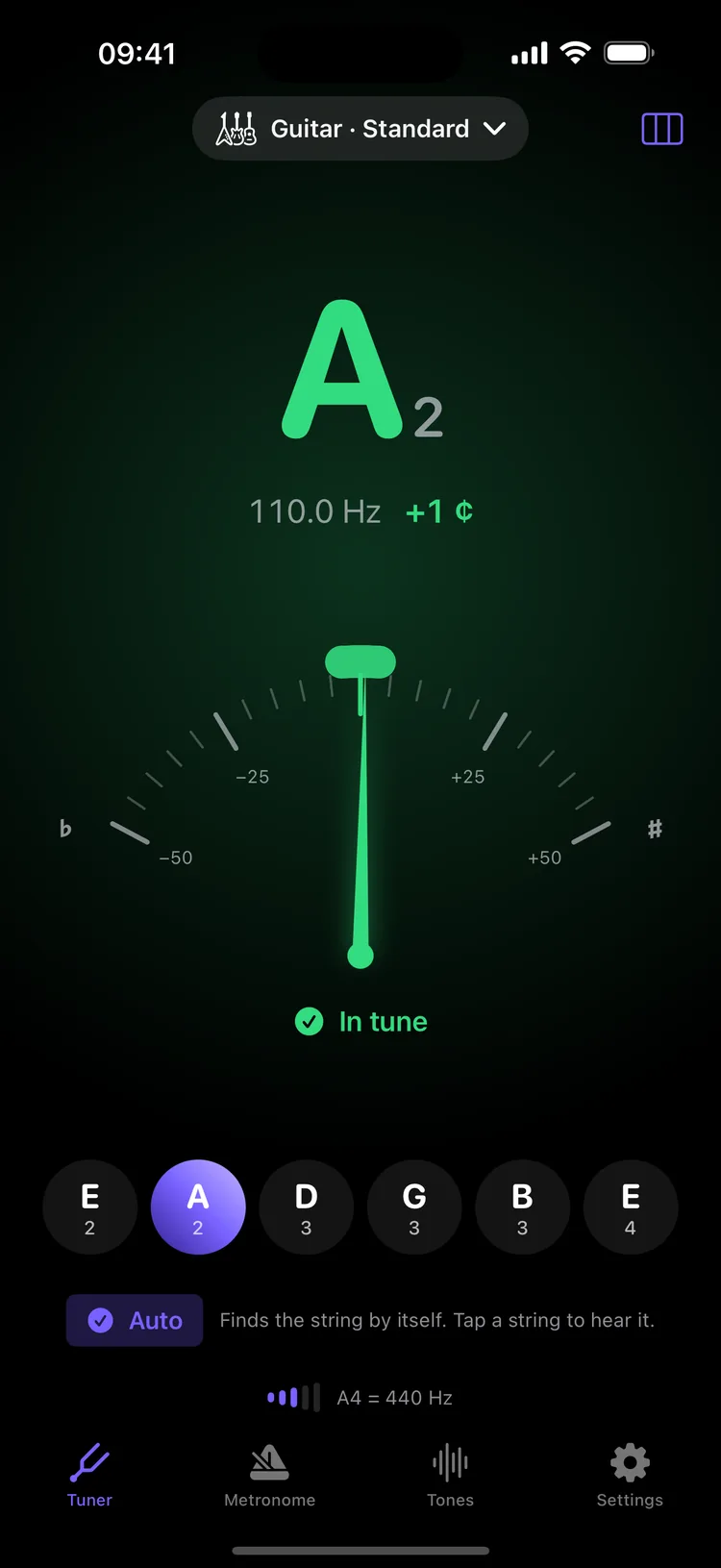 The A string in tune: a green needle at +1 cent and a check on the string