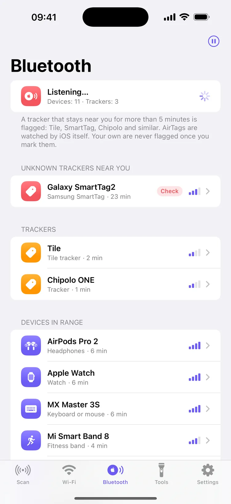 The Bluetooth tab listening, with 11 devices and 3 trackers: a Galaxy SmartTag2 flagged under Unknown trackers near you after 23 minutes, a Tile and a Chipolo ONE under Trackers, and devices in range below with signal bars